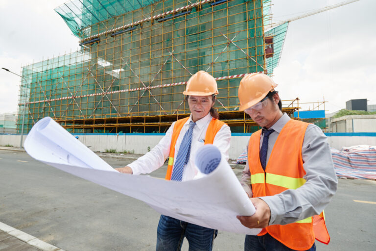 picture of 2 construction engineers looking at blueprint